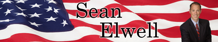 american flag and welcome to sean elwell page sign